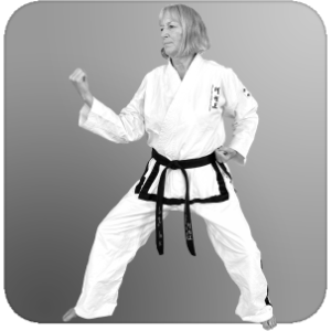 Person in back stance executing a middle inner-forearm block outward